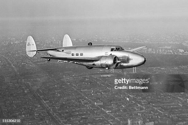 Howard Hughes' Lockheed 14 Super Electra over New York City