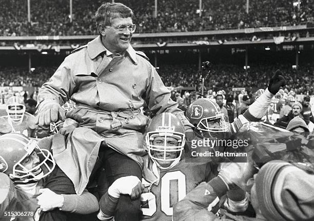 Cleveland, Ohio: Broncos coach Dan Reeves is carried from the field as his team won the AFC Championship.