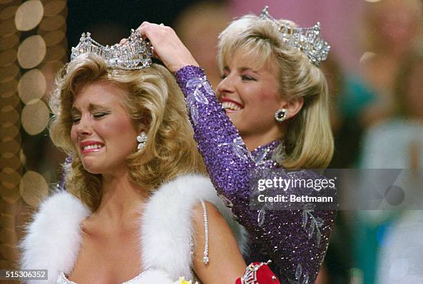 Atlantic City, New Jersey: Miss Mississippi, Susan Akin, cries as she is crowned Miss America 1986 by Miss America 1985, Sharlene Wells, at...