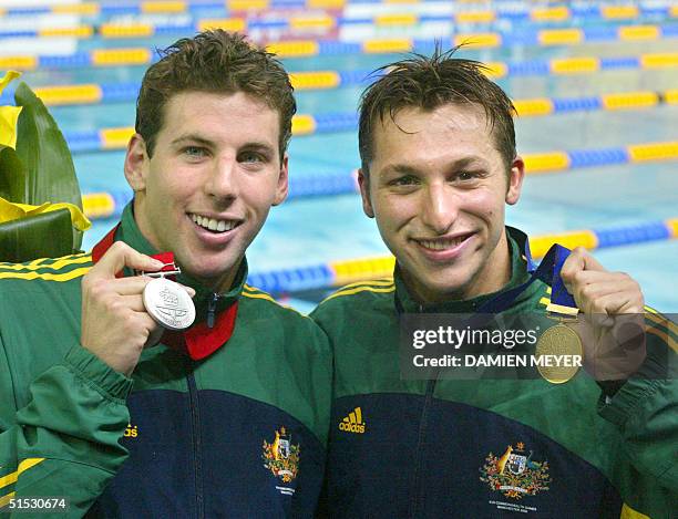 Australian gold medalist Ian Thorpe poses next to compatriot Grant Hackett after the 200m freestyle race during the 2002 Manchester Commonwealth...