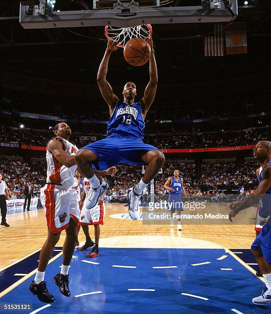 Dwight Howard of the Orlando Magic dunks during a preseason game against the Miami Heat at St. Pete Times Forum on October 15, 2004 in Tampa,...