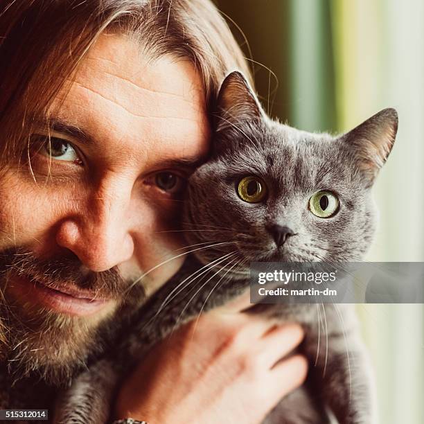 man and cat looking at camera - cat selfie stock pictures, royalty-free photos & images