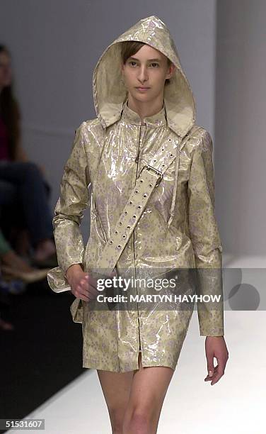 Model displays a rain jacket by designer Emma Cook during the 2003 spring-summer show 13 September 2002, at the London Fashion Week. AFP PHOTO/...