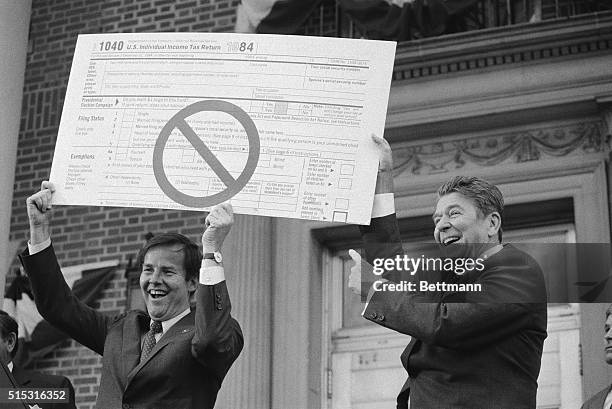 Bloomfield, NJ- President Reagan and NJ Governor Thomas Kean hold up a huge 1040 Income Tax Return with a "No" symbol on it during the Chief...