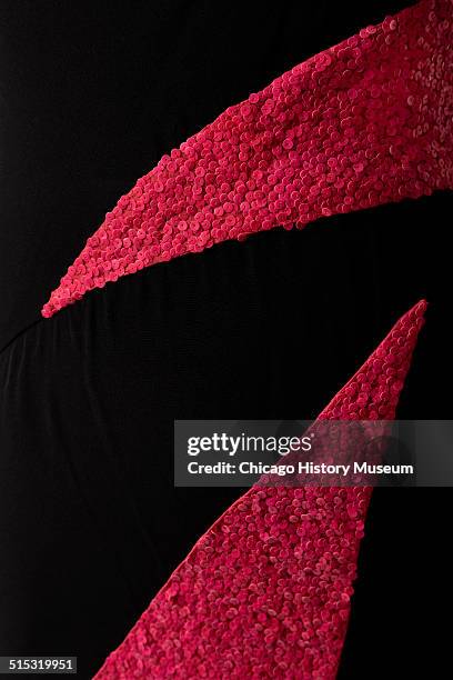 One-shouldered cocktail dress, designed by Karl Lagerfeld for Chloe, with red sequined triangular insets, 1982. Shown as part of the Chicago History...