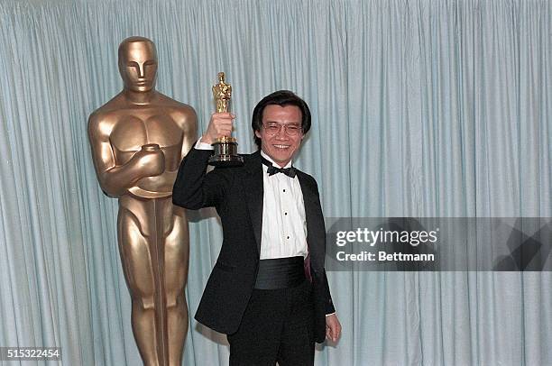 Hollywood, CA: Dr. Haing S. Ngor holds up the Oscar that he won for Best Supproting Actor at the 1984 Academy Awards Ceremony for his work in The...