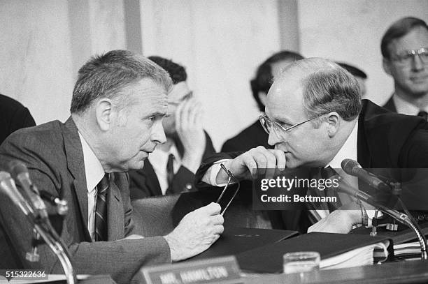 Rep. Lee Hamilton , D-Ind., chairman of the House select committee probing the Iran-Contra affair, confers with Rep. Richard Cheney, R-Wyo., vice...