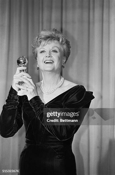 Hollywood: Actress Angela Lansbury holds up her Golden Globe award, which she won for best performance by an actress in a TV-series drama. The award...