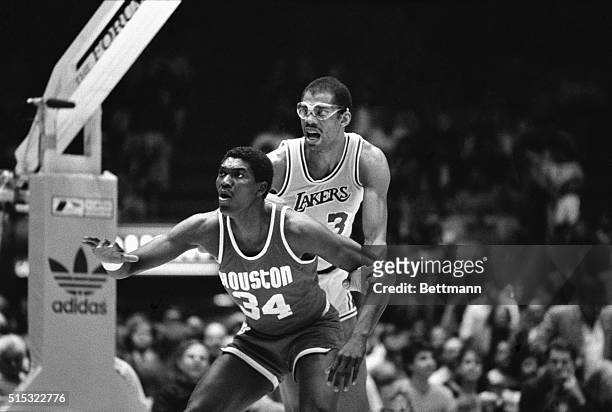 Inglewood, California- Los Angeles Lakers 37-year old center Kareem Abdul-Jabbar stays close to Houston Rockets rookie center Akeem Olajuwon during...