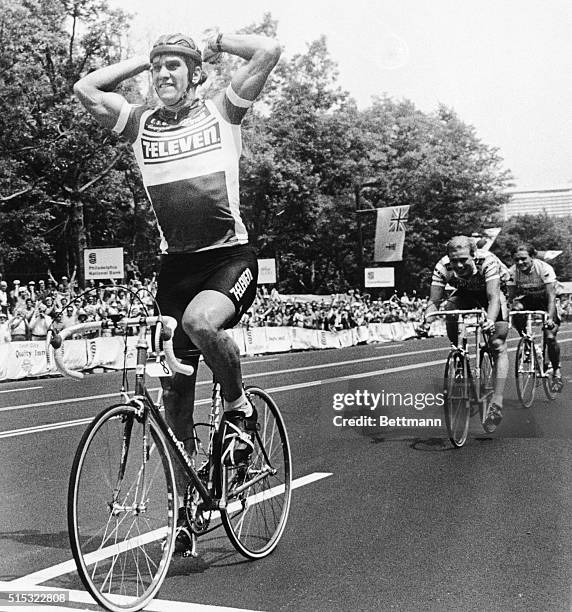 Eric Heiden, who won five gold medals in the 1980 Winter Olympics, raises his arms as he wins the first ever pro bike race in the United States in...