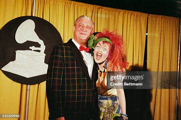 Los Angeles: "Best New Artist" Grammy presenters Rodney Dangerfield and Cyndi Lauper clown around after the ceremony at Shriner's Auditorium.