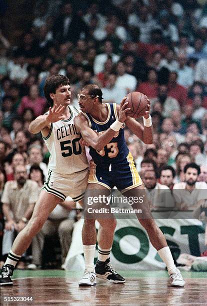 Boston, MA- Celtics', Greg Kite, guards Laker's, Kareem Abdul-Jabbar, closely in the 3rd quarter of the 3rd game, in the NBA Finals at the Boston...