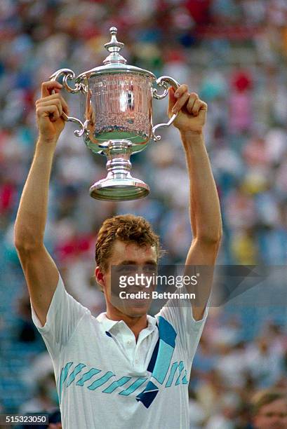 New York: Ivan Lendl holds U. S. Open trophy 9/8 after defeating John McEnroe 7-6, 6-3, 6-4 here.