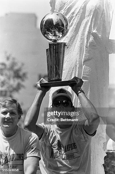 Los Angeles: LA Laker team captain Kareem Abdul-Jabbar holds up the NBA Championship trophy during the Lakers victory parade 6/11. The Lakers...