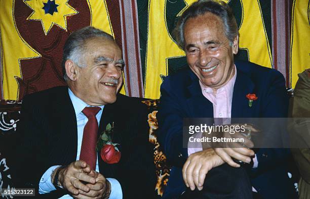 Tel Aviv: Prime Minister Yitzhak Shamir shares a laugh with opposition leader of the Labor Party Shimon Peres during the festivities of the...