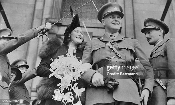 Wearing his army officer's uniform, Randolph Churchill, son of Winston Churchill, First Lord of the British Admiralty, is shown leaving St. John's...