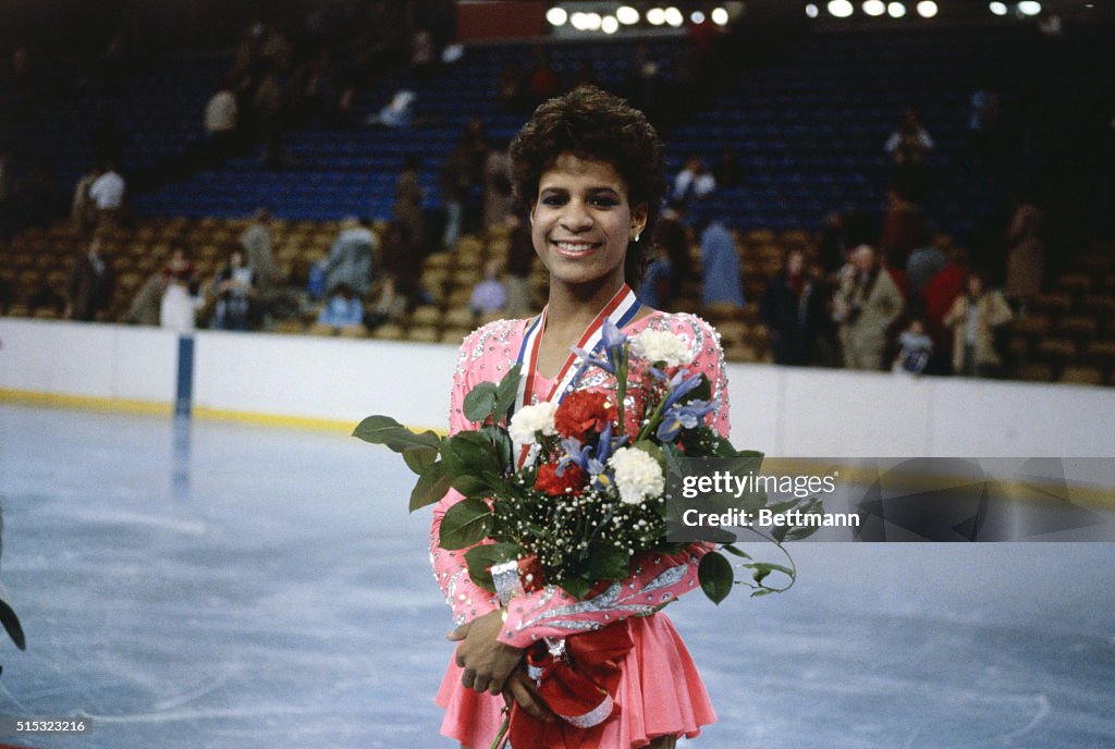 Portrait of Ice Skating Champion Debi Thomas with Bouquet
