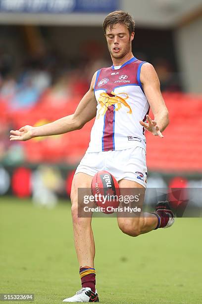 Josh Schache of the Lions kicks during the NAB Challenge AFL match between the Brisbane Lions and the Greater Western Sydney Giants at Metricon...