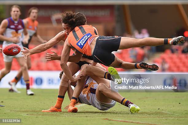 Jack Steele collides with Josh Kelly of the Giants as he is tackled during the NAB Challenge AFL match between the Brisbane Lions and the Greater...