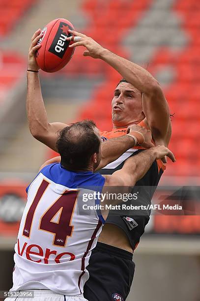 Phil Davis of the Giants marks during the NAB Challenge AFL match between the Brisbane Lions and the Greater Western Sydney Giants at Metricon...