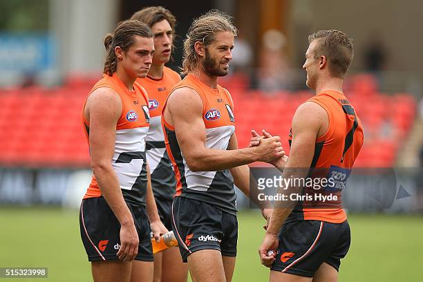 Callan Ward and the Giants celebrate winning the NAB Challenge AFL match between the Brisbane Lions and the Greater Western Sydney Giants at Metricon...