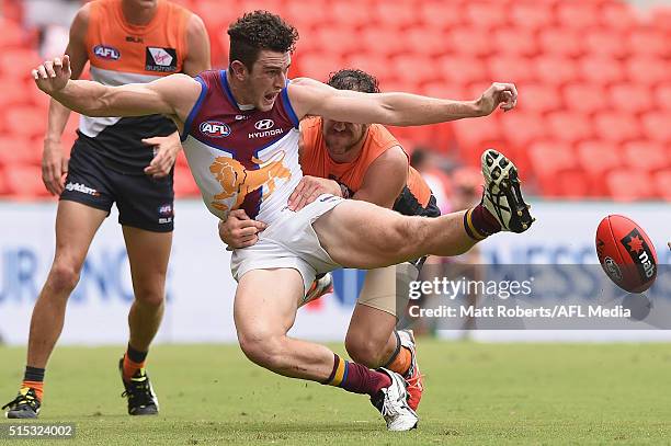 Daniel McStay of the Lions kicks at the ball during the NAB Challenge AFL match between the Brisbane Lions and the Greater Western Sydney Giants at...