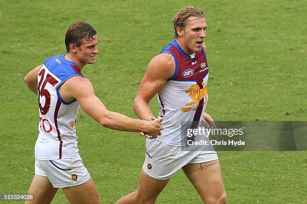 Tom Bell of the Lions celebrates after kicking a goal during the NAB Challenge AFL match between the Brisbane Lions and the Greater Western Sydney...