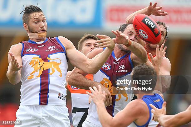 Stefan Martin and Josh Walker of the Lions compete for the mark during the NAB Challenge AFL match between the Brisbane Lions and the Greater Western...