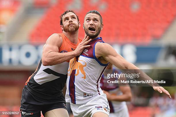 Shane Mumford of the Giants competes for the ball against Stefan Martin of the Lions during the NAB Challenge AFL match between the Brisbane Lions...