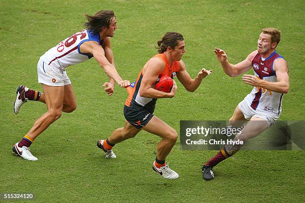 Jack Steele of the Giants runs the ball during the NAB Challenge AFL match between the Brisbane Lions and the Greater Western Sydney Giants at...