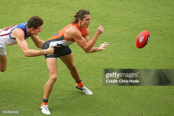 Jack Steele of the Giants handballs during the NAB Challenge AFL match between the Brisbane Lions and the Greater Western Sydney Giants at Metricon...