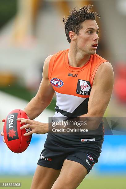 Josh Kelly of the Giants runs the ball during the NAB Challenge AFL match between the Brisbane Lions and the Greater Western Sydney Giants at...