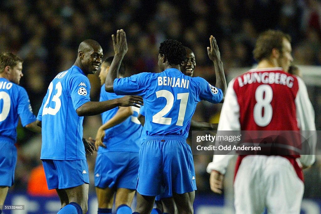 Auxerre's Olivier Kapo (L) is congratulated by his