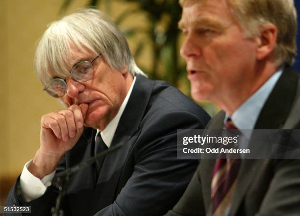 Formula 1 boss Bernie Ecclestone listens to Max Mosley ,President of FIA during a press conference in west London 28 October 2002.Formula one...