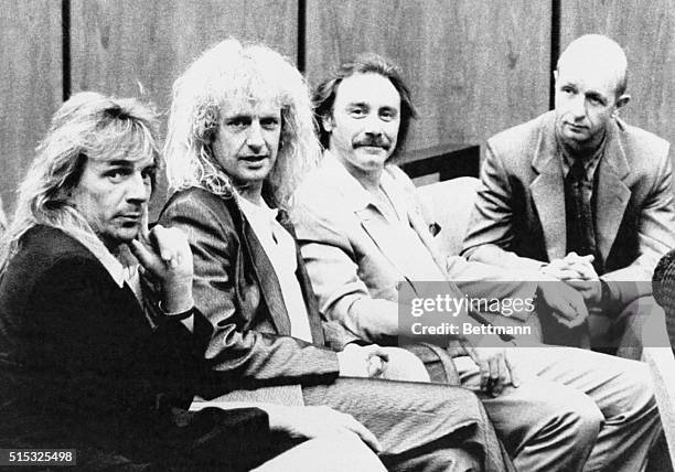 Judas Priest members Glenn Tipton, K.K. Downing, Ian Hill, and Rob Halford kick back during a break in the trial Monday, in Reno. The non-jury trial...