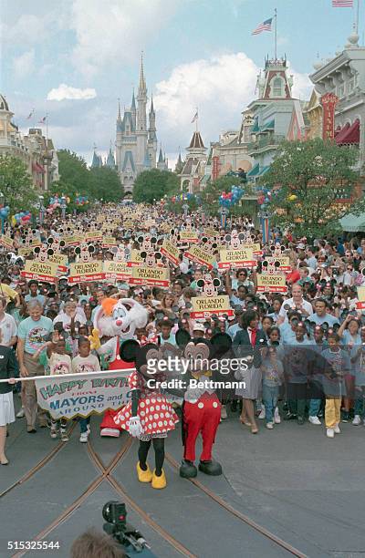 Lake Buena Vista, Fla.: Mickey leads the parade down Main Street at the Magic Kingdom accompanied by Minne. Disney World celebrated Mickey's 60th...