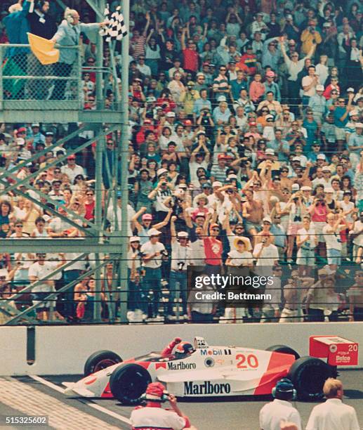 Indianapolis: Emerson Fittipaldi of Brazil waves his fist as he crosses the finish line to win the Indianapolis 500. Fittipaldi led 158 of the 200...