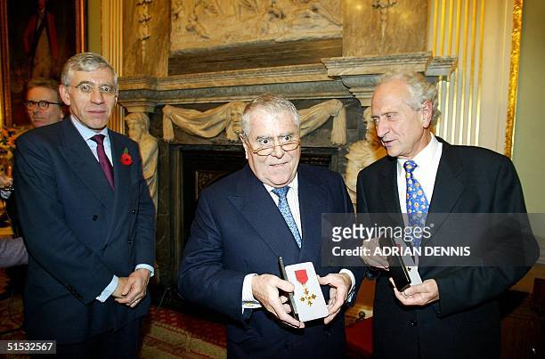 Britain's Foreign Secretary Jack Straw after presenting French cooks Albert and Michel Roux with their honorary OBE medals at the Foreign Office in...