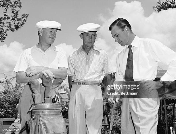 Ben Hogan, right, looking much better following his narrow escape in an auto accident near El Paso, Texas, earlier this year, visits with Byron...