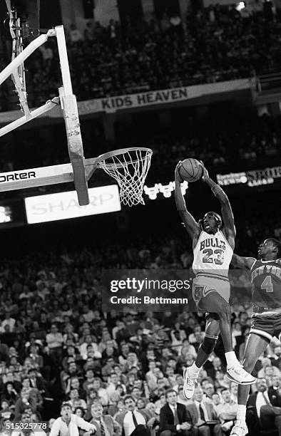 New York Knicks' Patrick Ewing defends against Bulls' Michael Jordan's shot in the second quarter of the game, 12/29.