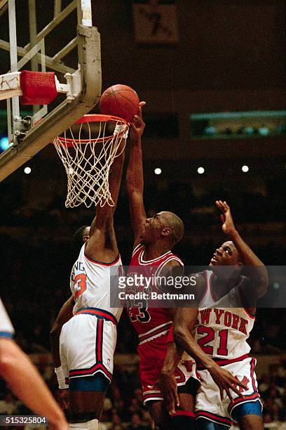 Chicago Bulls' Michael Jordan has his shot blocked by Patrick Ewing of the New York Knicks, during their NBA playoff game here 5/16. Jordan was...