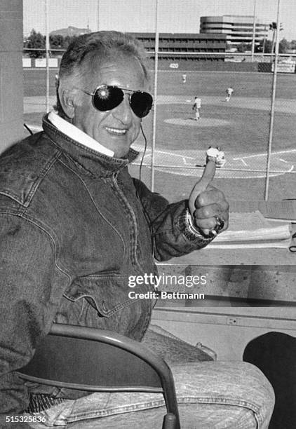 The voice of the Milwaukee Brewers. Bob Uecker, signals all is well as he gets back into the press box. 3/4 for the first time after suffering a mild...