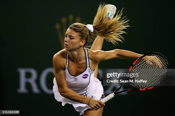 Camila Giorgi of Italy serves to Ana Ivanovic of Serbia during the BNP Paribas Open at the Indian Wells Tennis Garden on March 11 at Indian Wells...