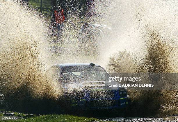 Finnish Tommi Makinen goes through the water splash in his Subaru Impreza World Rally Car during the Margam Park special stage 16 during the final...