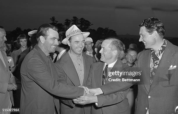 Bobby Jones, a hot man with a golf club himself, congratulates the top men in the Masters tourney at Augusta. Left to right are Lloyd Mangrum, Sammy...