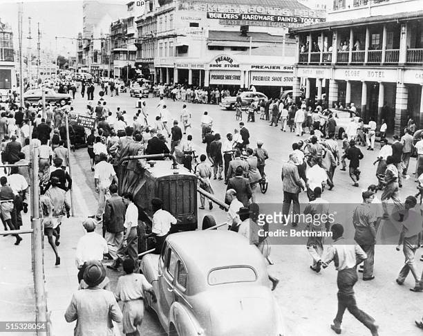 Durban, South Africa: Race Riot. Natives race through Durban's Pine Street, seeking new victims, at the height of the three day race riot between...
