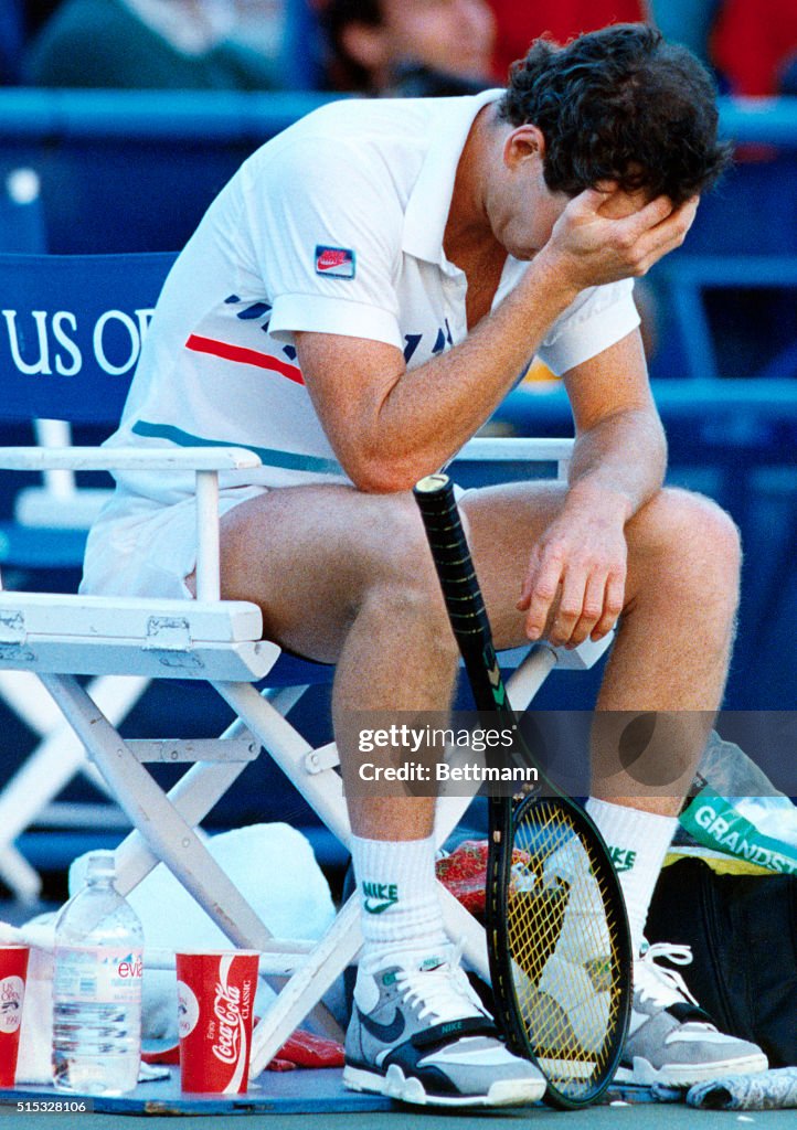 John McEnroe Resting Head in Hand Between Sets