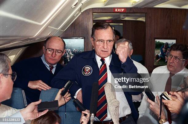 Washington: President Bush speaks to reporters aboard Air Force One en route to stop in Memphis. President Bush discussed his decision to send a...