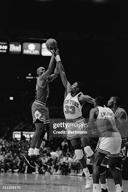 New York Knicks Patrick Ewing blocks a shot attempt by the Chicago Bulls' Michael Jordan in the final minutes of the Knicks' 121-114 win in game five...