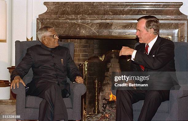 Tokyo: Indian President Ramaswamy Venkakataraman listens as President George Bush speaks during their meeting at the U. S. Ambassador's residence on...